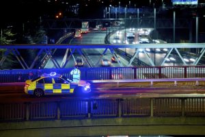 Motorway junction closed after man falls from bridge