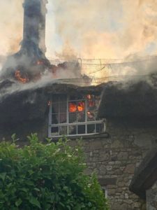 Over thirty firefighters tackle thatched roof blaze on the Isle of Wight