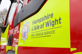 Firefighters urge people in the Gosport area to stay inside and to avoid the area as they tackle a large garage fire